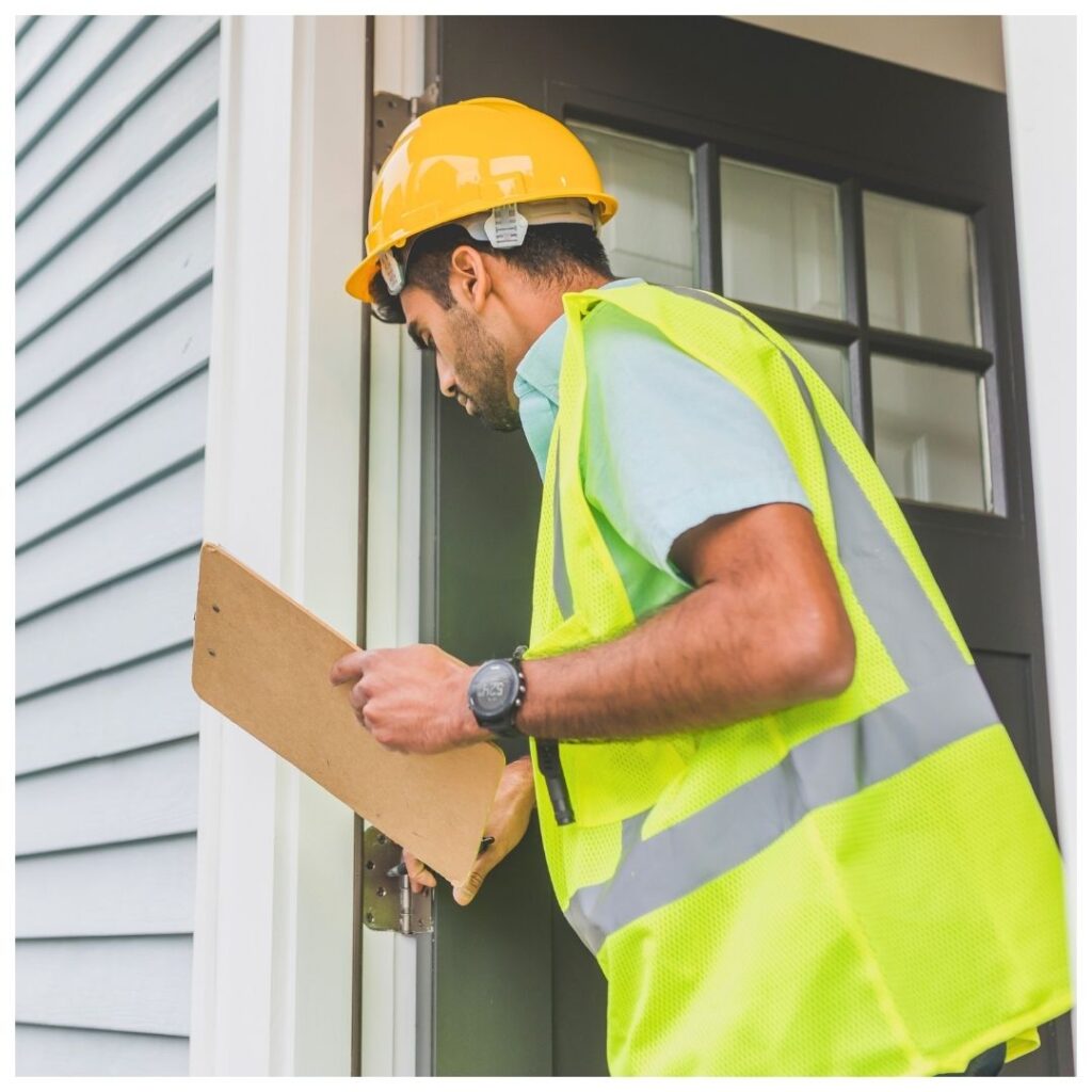 an inspector examining the exterior of a business
