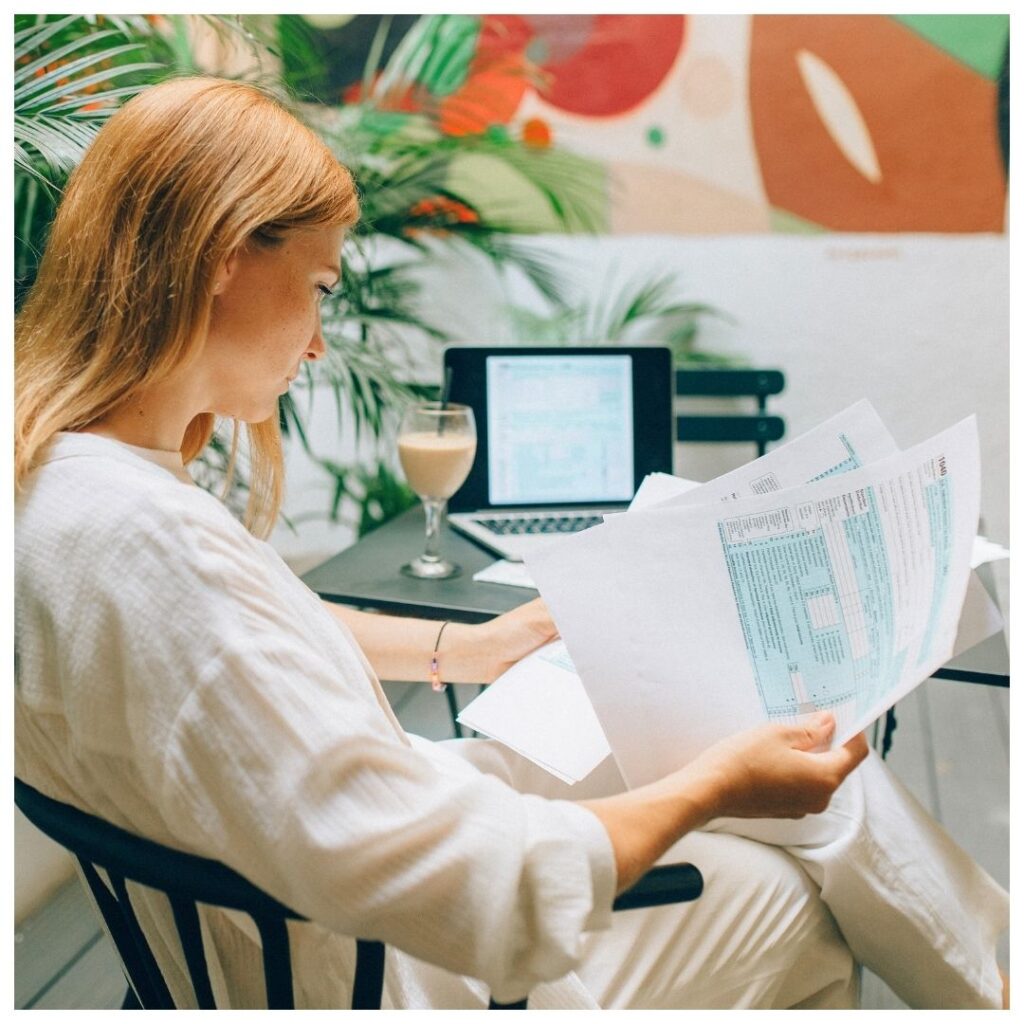 a woman reviewing financial paperwork
